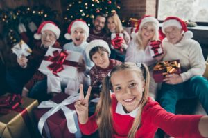 Christmas gift ideas for family- a muilti-generational family gathers with presents